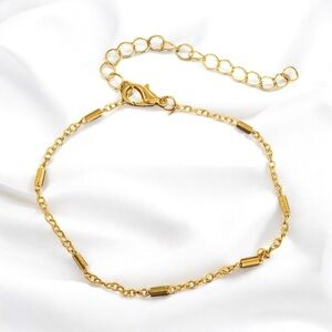 Gold plated women’s 6.7 inch bracelet. Adjustable size.